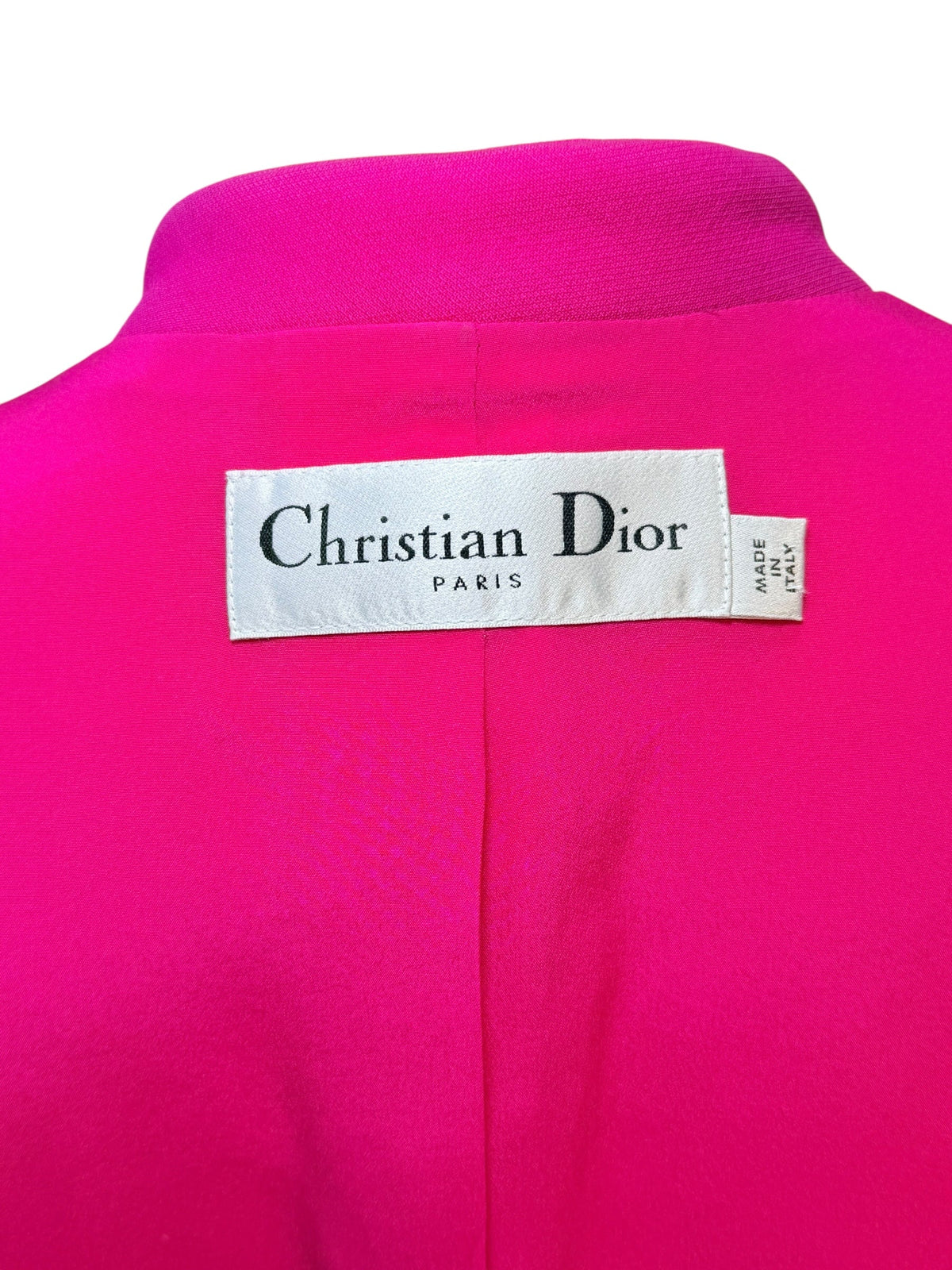 Christian Dior label on pink vintage designer garment from Refined Concierge Consignment
