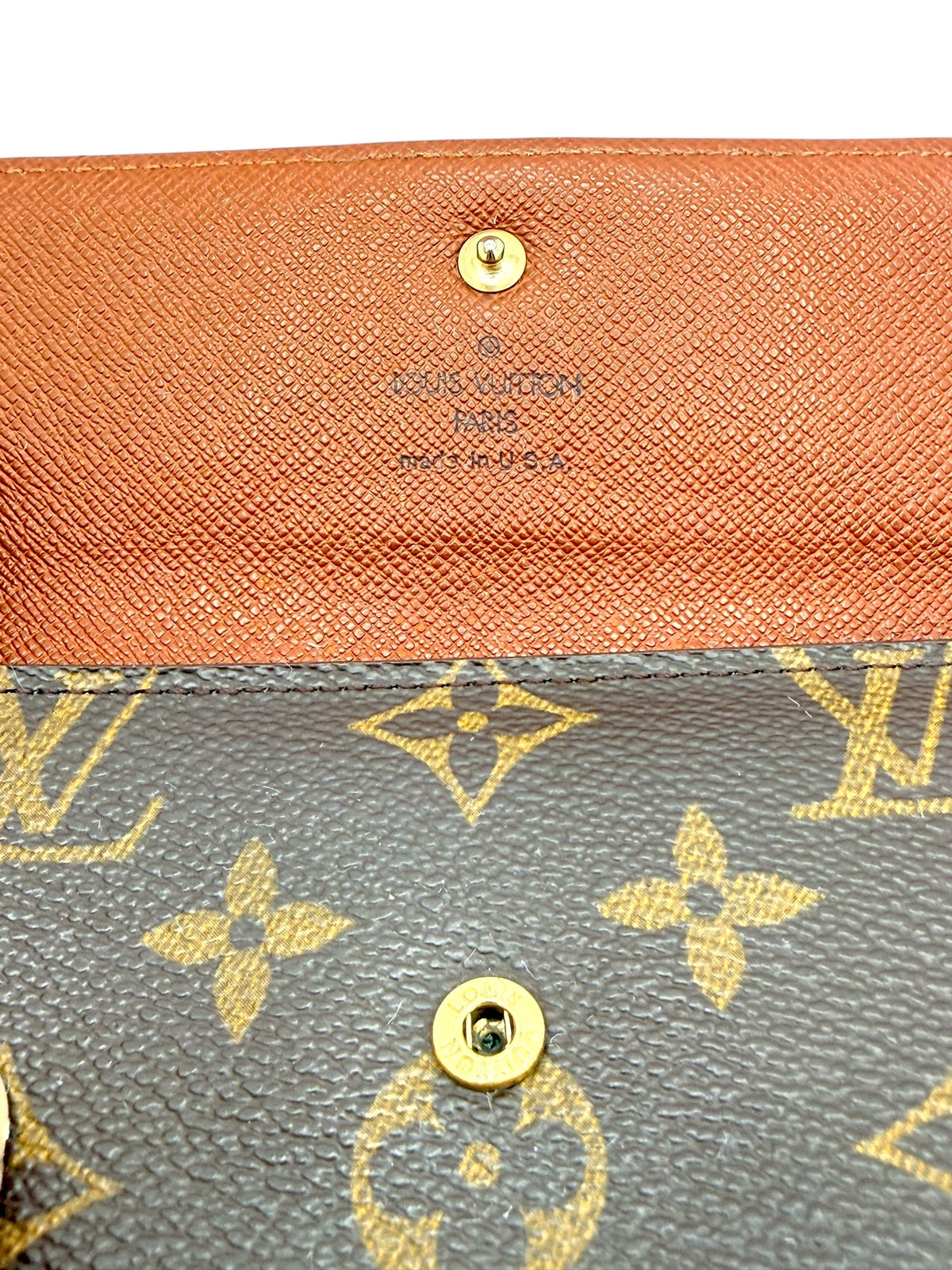 Louis Vuitton Monogram canvas and tan leather detail with branded stamp