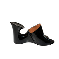 Alaia Black patent shoe with a unique sculptural design left shoe inside side view on a white background