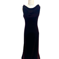 Front view of an archival Alaïa Fall Winter 2008 burgundy velvet evening gown featuring a draped cowl neckline and sculpted silhouette, made in Italy.