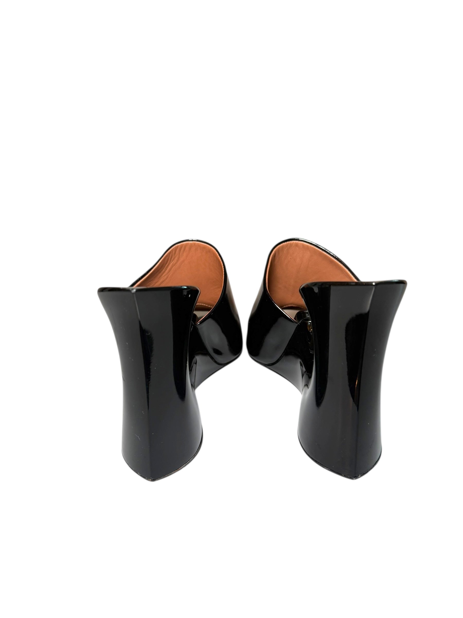 Black Alaia leather high-heeled mule shoes with brown soles back view on a white background