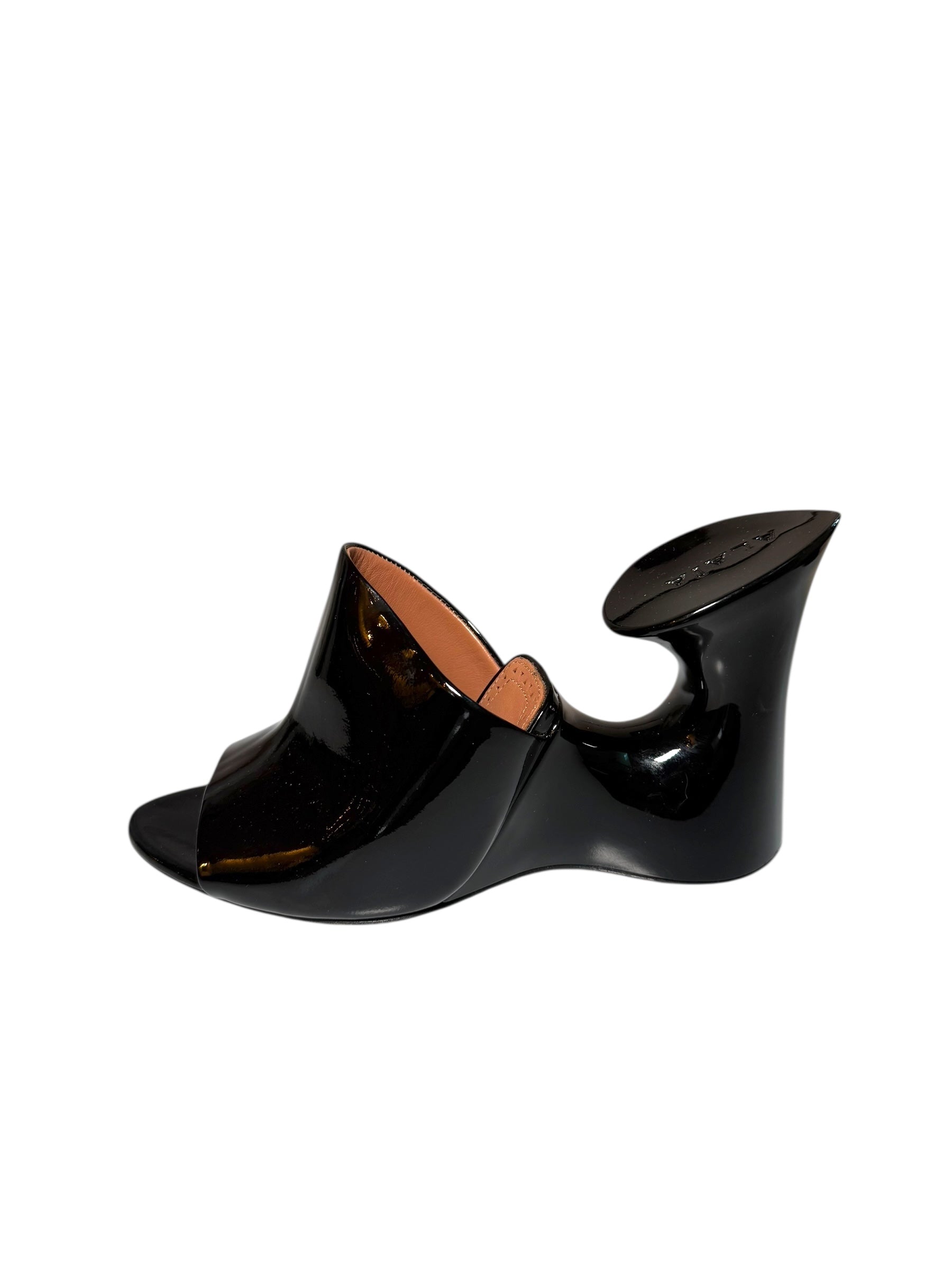 Alaia patent Black wedge mule left shoe side view on a white background