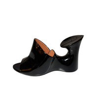 Alaia patent Black wedge mule left shoe side view on a white background