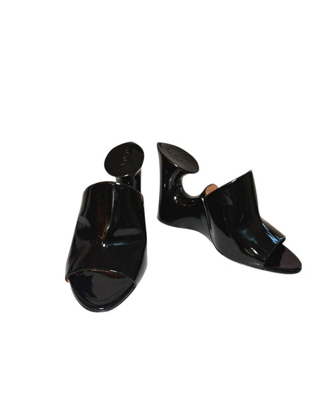Alaia Black high-heeled patent black mule shoes with sculptural design on a white background main photo