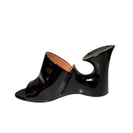 Black patent Alaia high-heeled mule wedge right shoe inside left view on a white background