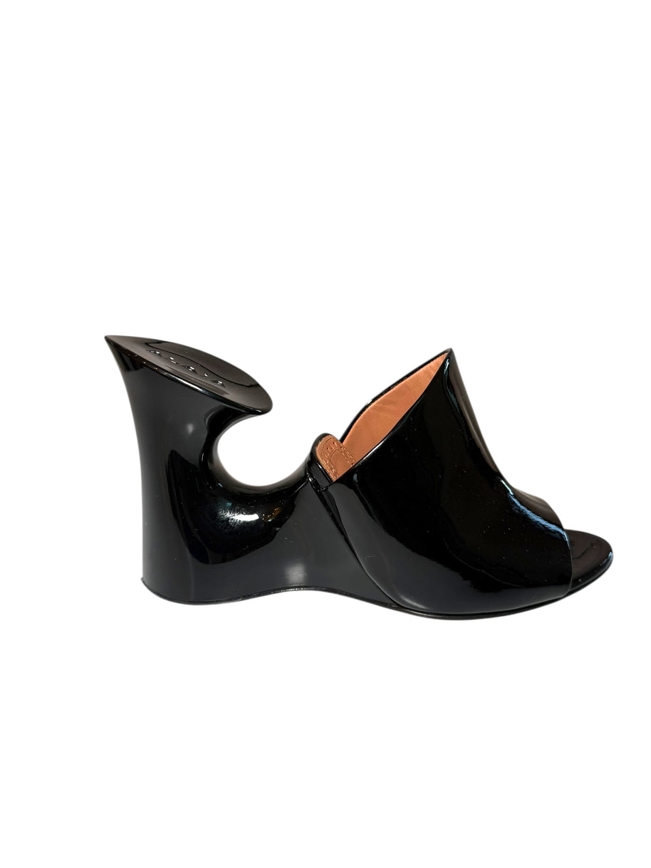 Black Alaia wedge mule right shoe outside side view on a white background