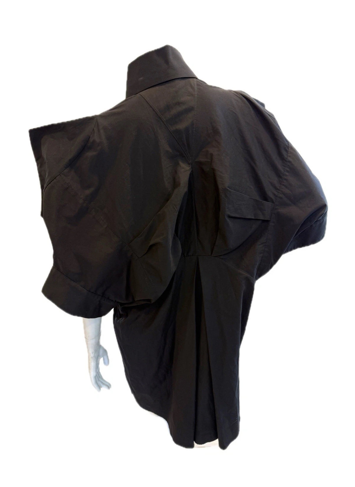 Alexander McQueen Black shirt dress detailing structured shoulders on a mannequin against a white background