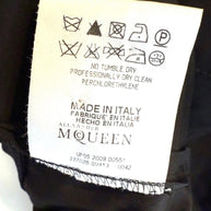Alexander McQueen Black Shirt Dress Clothing label with care instructions and brand name on a garment.