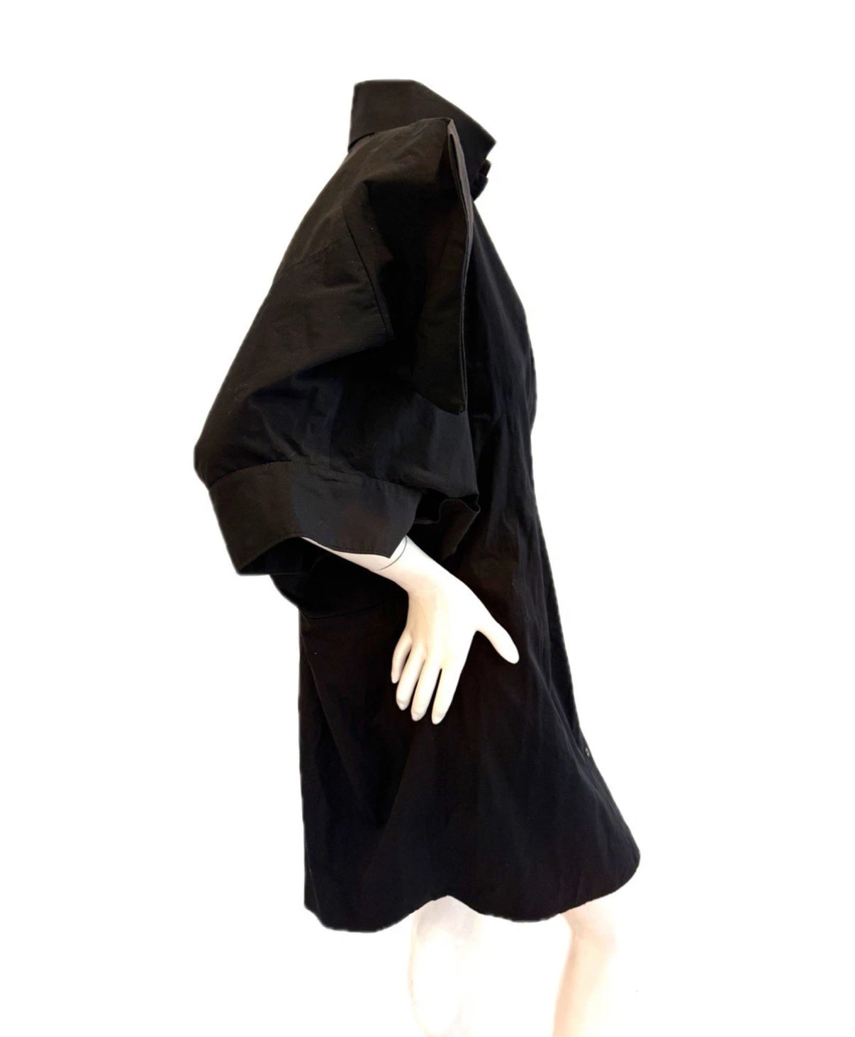 Alexander McQueen Black dress on a mannequin close up right side view against a white background