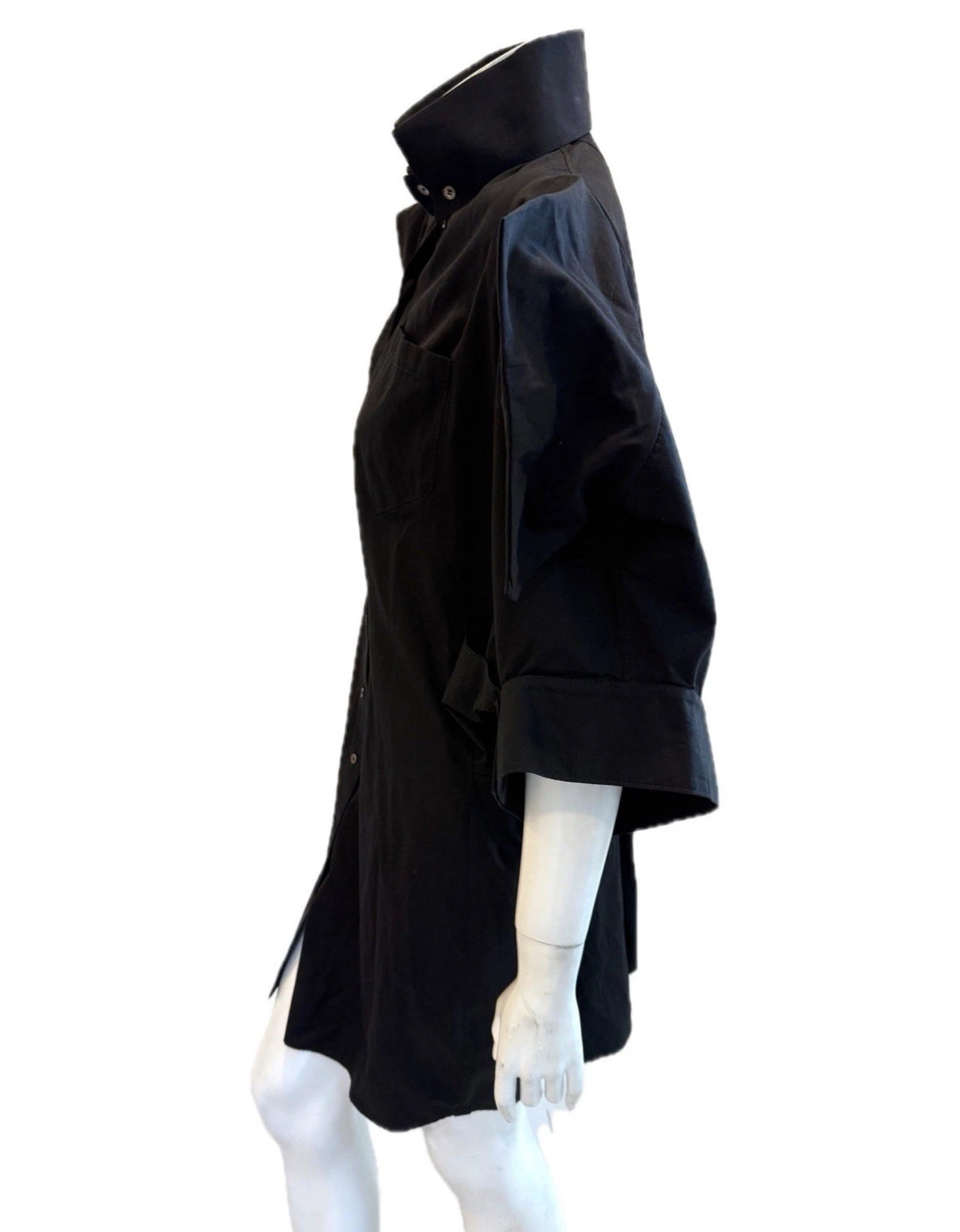 Alexander McQueen Black shirt dress detailing up close left side view on a mannequin against a white background