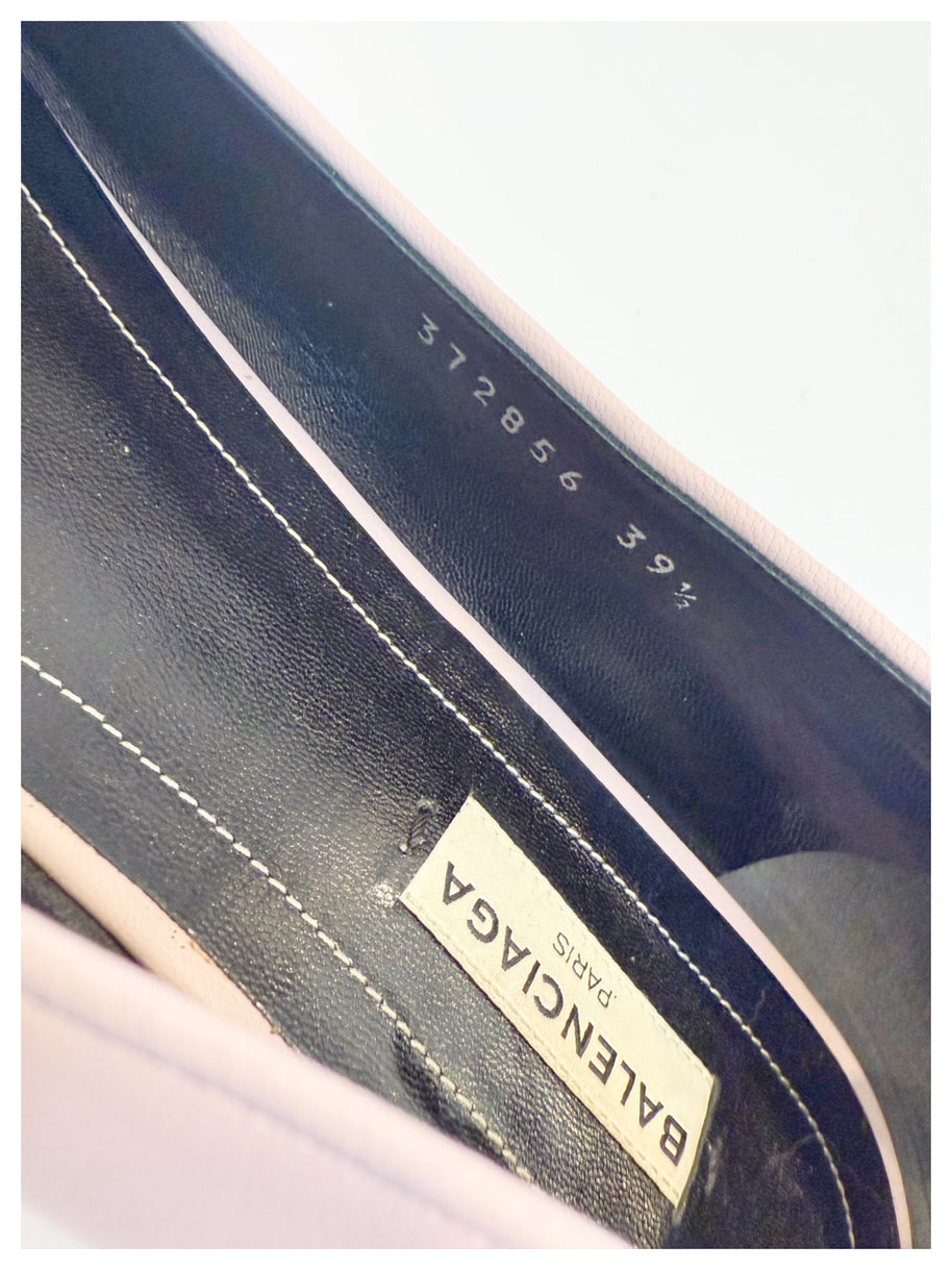 Zoomed interior shot of Balenciaga ballet flat showing the logo label, black leather insole, and size stamp “372856 39.5.”