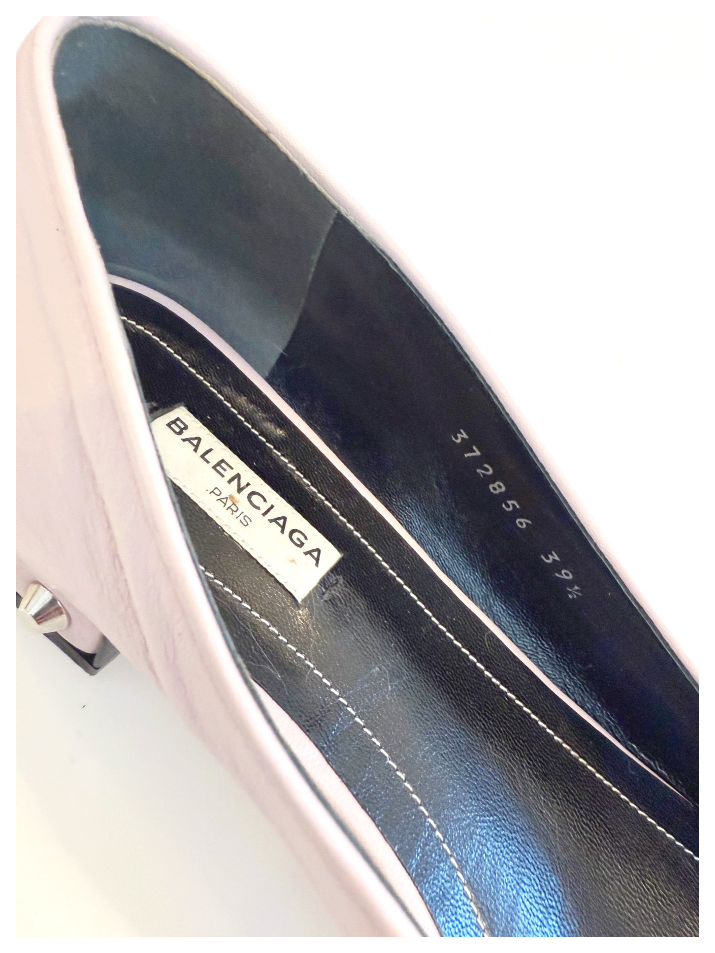 Detailed interior shot of Balenciaga ballet flat showing the logo label, black leather insole, and size stamp “372856 39.5.”