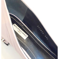 Detailed interior shot of Balenciaga ballet flat showing the logo label, black leather insole, and size stamp “372856 39.5.”