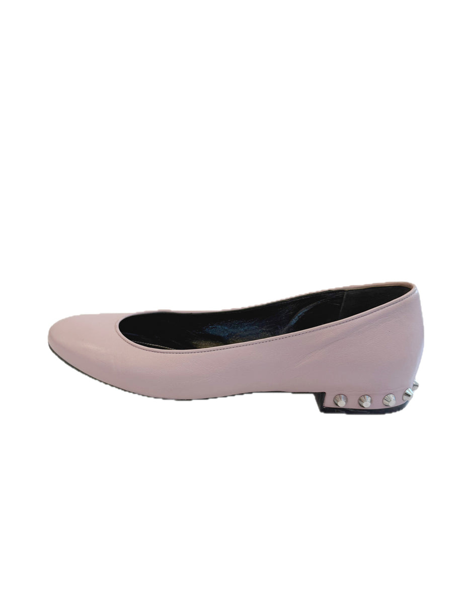 Outer profile view of Balenciaga powder pink lambskin ballet flats highlighting the rounded toe and silver studded heel design.