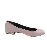 Inner profile view of the Balenciaga powder pink lambskin flats showing soft leather texture and studded heel.