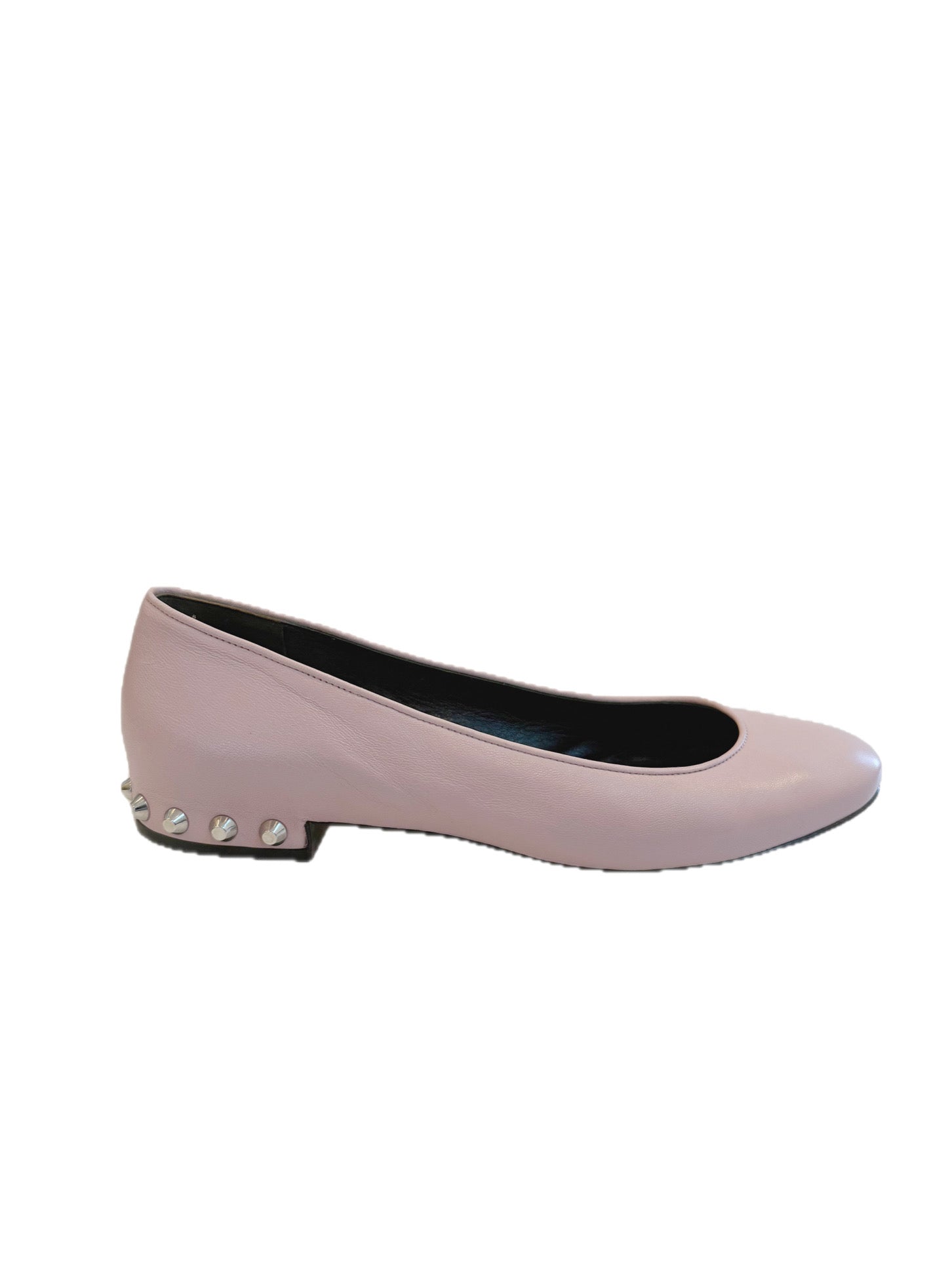 Left-side profile of Balenciaga powder pink lambskin flats featuring a rounded toe and low studded heel on a white background.