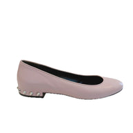 Left-side profile of Balenciaga powder pink lambskin flats featuring a rounded toe and low studded heel on a white background.