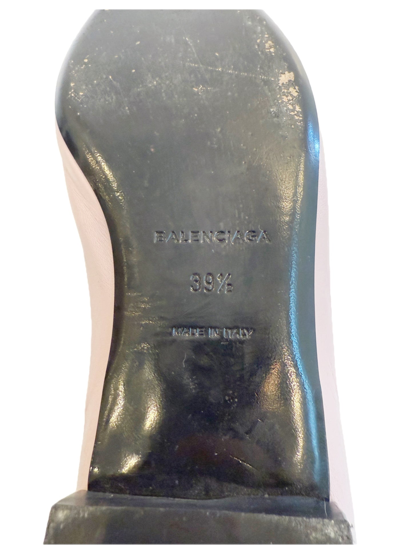 Close-up of Balenciaga sole stamp showing embossed logo, size 39.5, and “Made in Italy” marking on worn black leather sole.