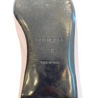 Close-up of Balenciaga sole stamp showing embossed logo, size 39.5, and “Made in Italy” marking on worn black leather sole.