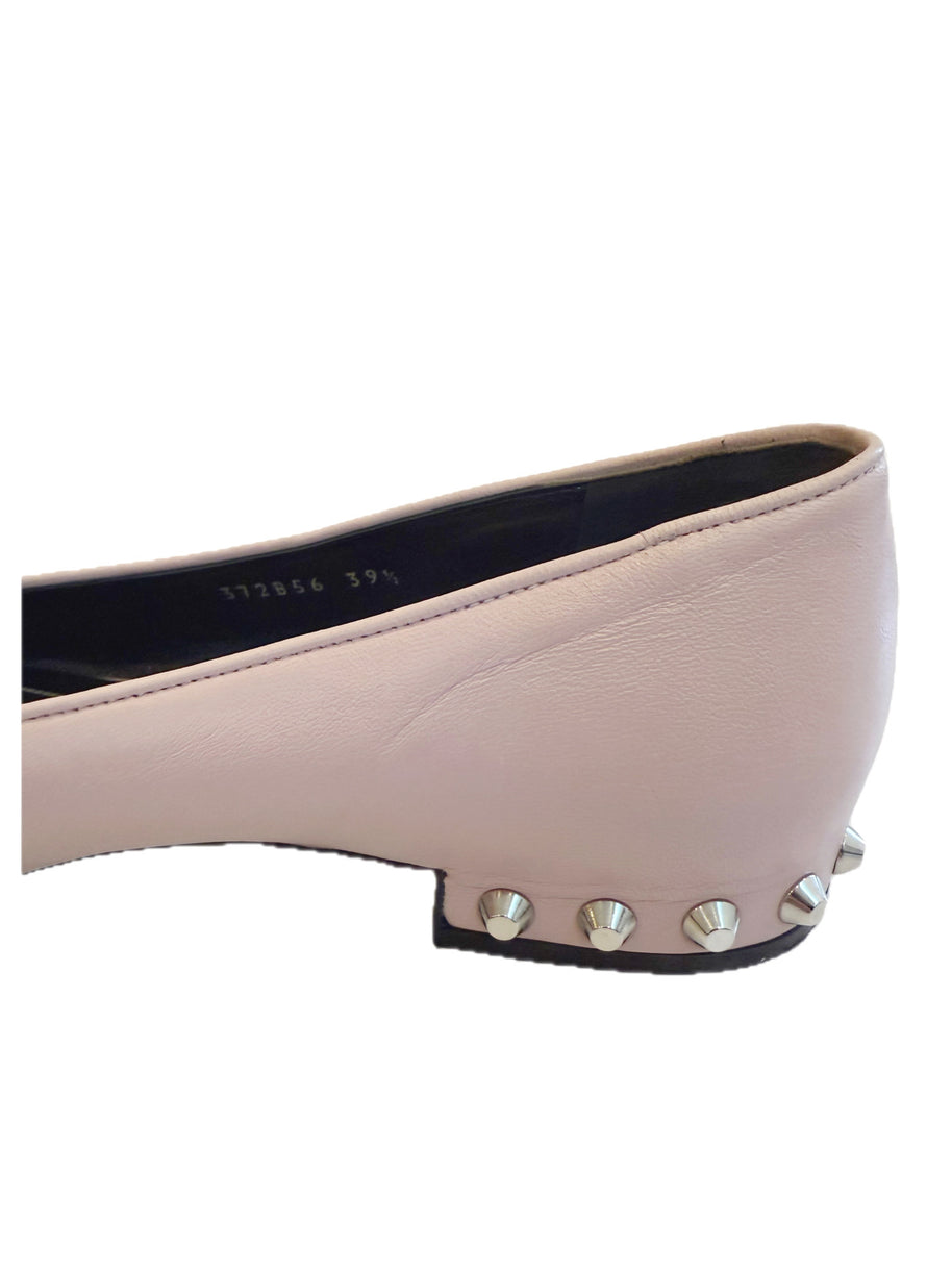 Close-up detail of the Balenciaga ballet flat heel showing silver cone studs set into the sculpted low heel.
