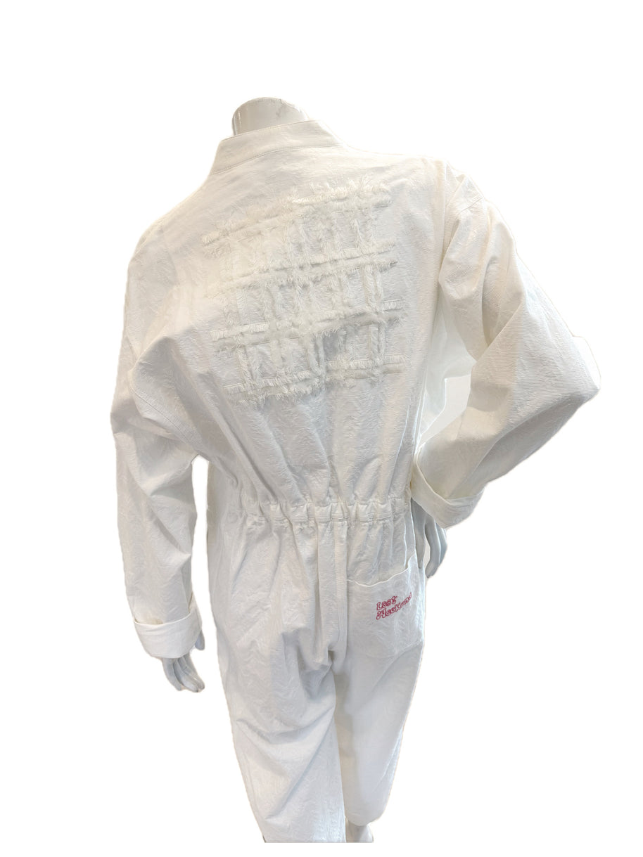 Close-up of back lattice appliqué on the Bernhard Willhelm SS20 “Lost Weekend” white jumpsuit.