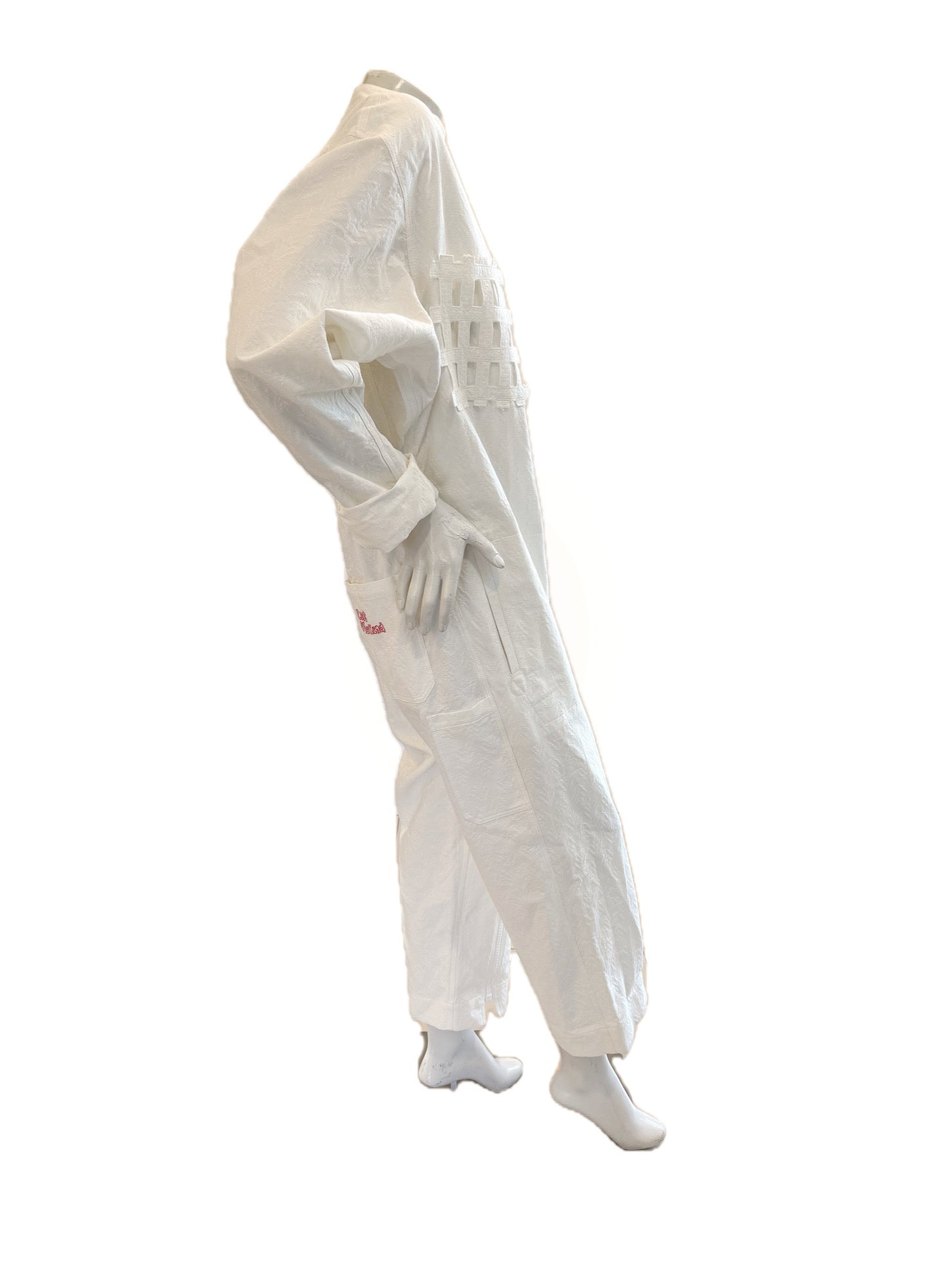 Right side view showing textured jacquard fabric and oversized sculptural fit.