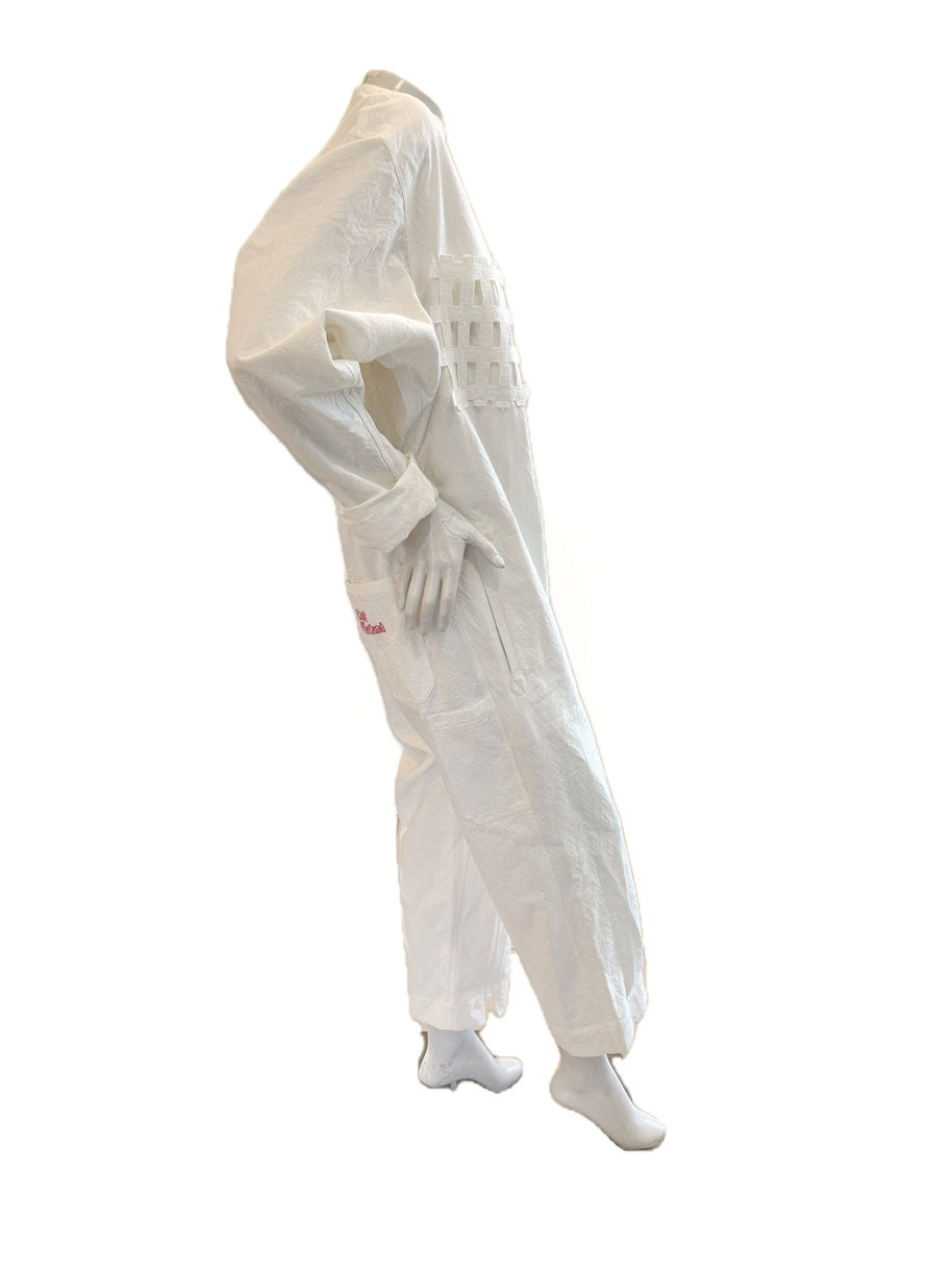 Right side view showing textured jacquard fabric and oversized sculptural fit.