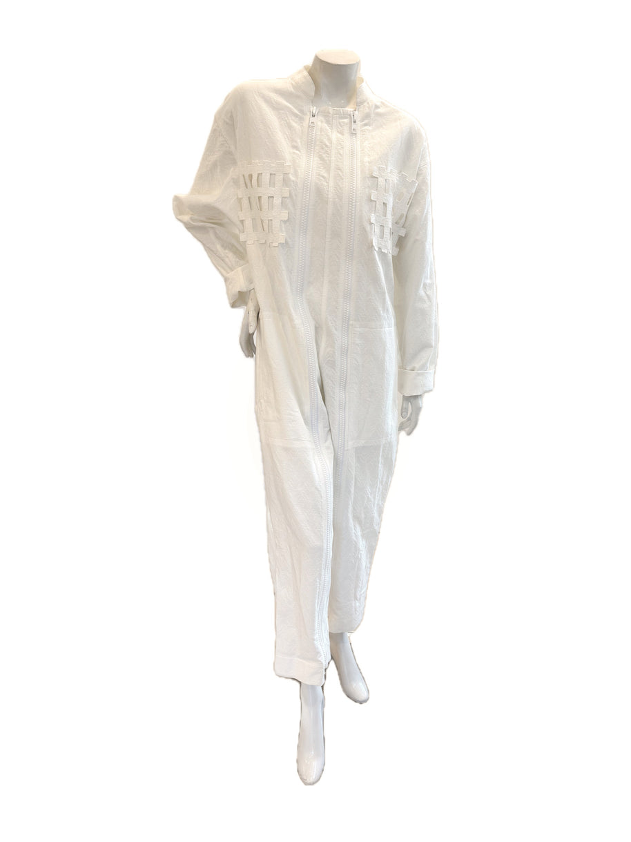 Front view of Bernhard Willhelm SS20 “Lost Weekend” oversized white jacquard jumpsuit with dual zippers and lattice appliqué.