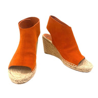 Burnt orange Céline suede espadrille wedges shown at a front angle, highlighting the open-toe silhouette and natural jute wedge.