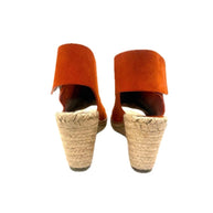 Rear view showing the jute-wrapped wedge heels and clean lines of the suede slingback strap.