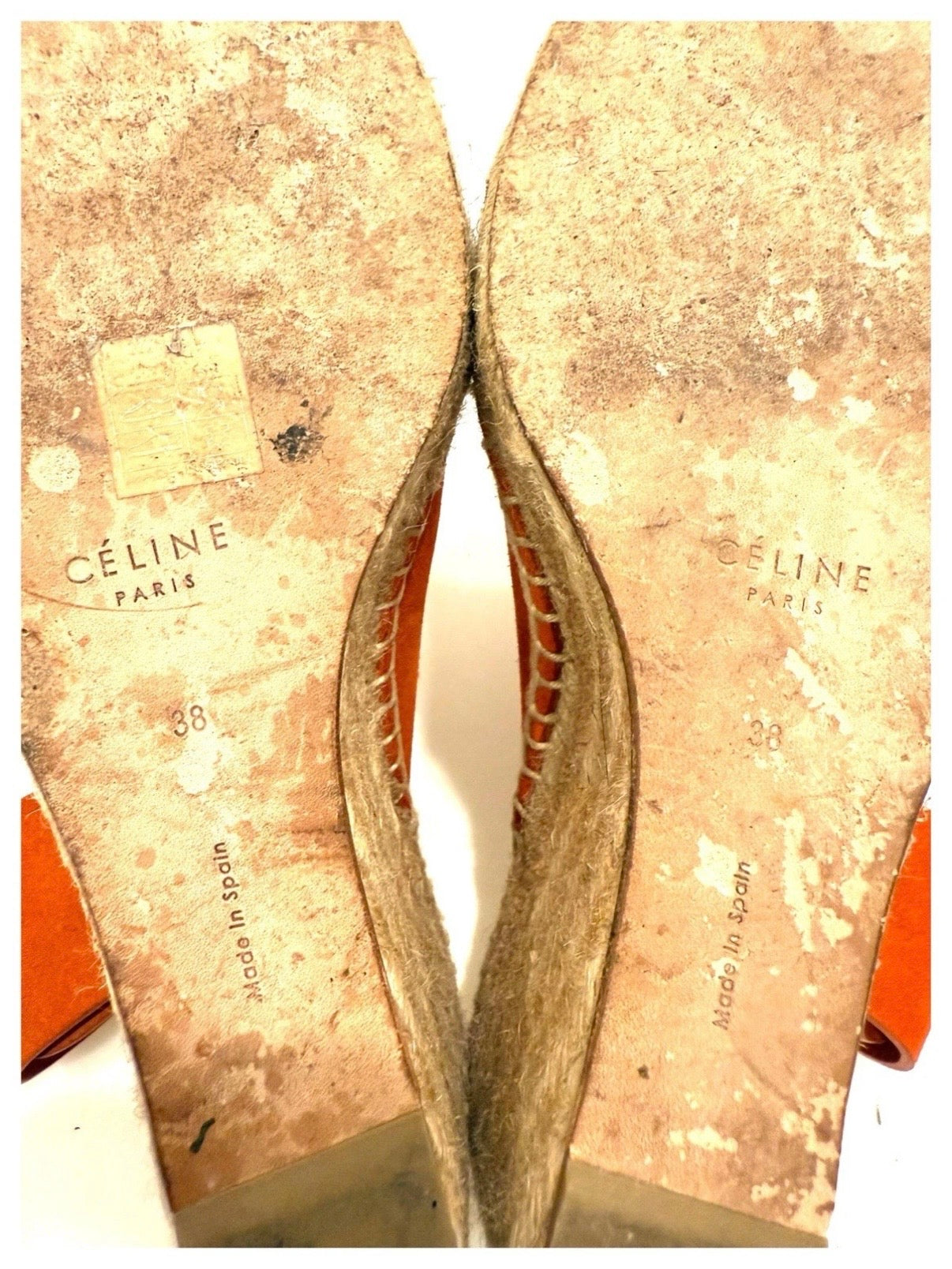 Close-up view of the sandal soles highlighting the Céline Paris logo, size 38 stamp, and Made in Spain markings with visible wear consistent with use.