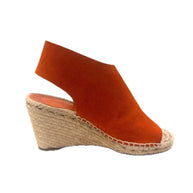Burnt orange suede Céline wedges shown from a side angle to display the contour of the upper and wedge.