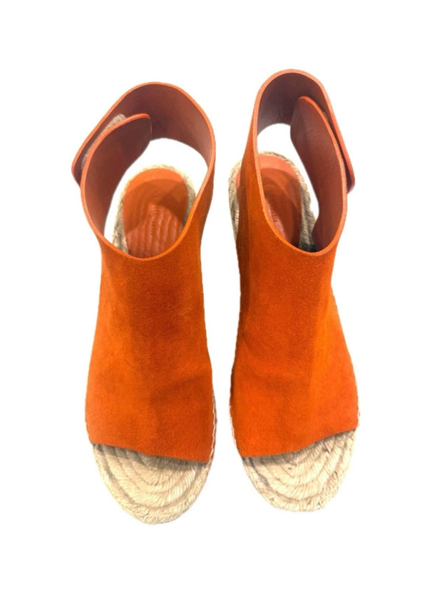 Top-down view of the Céline burnt orange suede wedges showing the wide suede vamp and Velcro slingback opening.