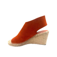 Right-side view highlighting the warm terracotta suede and stitched jute platform.