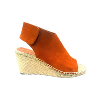 Side profile of the Céline suede espadrille featuring the natural woven jute wedge and sculptural suede upper.