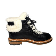 Chanel Quilted Black Leather and White Shearling Lined Hiking Boot Inside View of Left Shoe Black boot on a white background