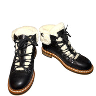 Black quilted leather lace-up Chanel hiking boots with white fur lining size 38.5 main product photo on a white background