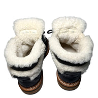 Chanel Quilted Black leather and shearling lined hiking boots Pair of boots with visible product label including style code and size of 38.5 in both shoes on a white background