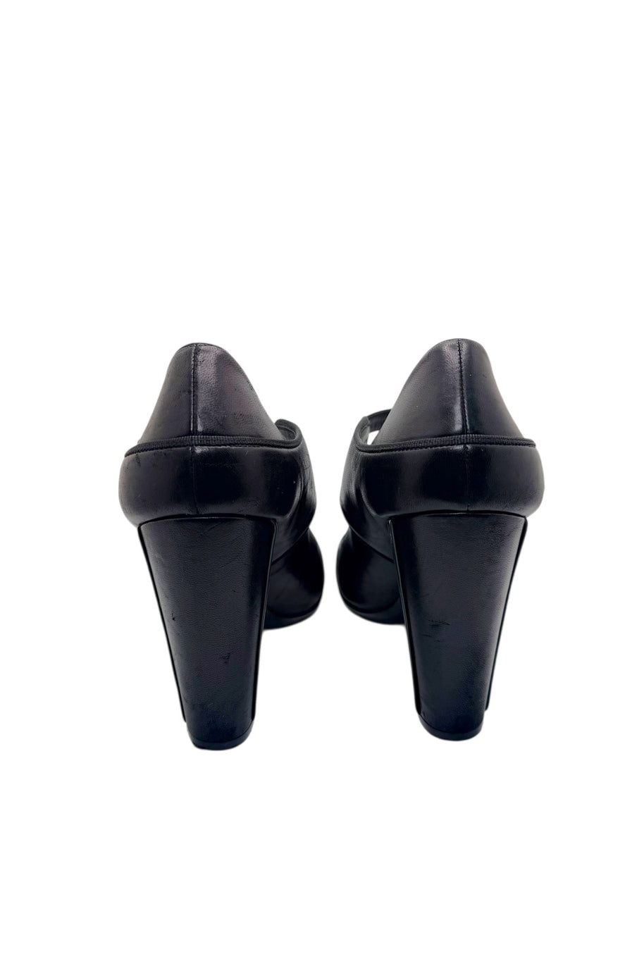 Rear view of Chanel block heel pumps showing heel shape and leather finish.