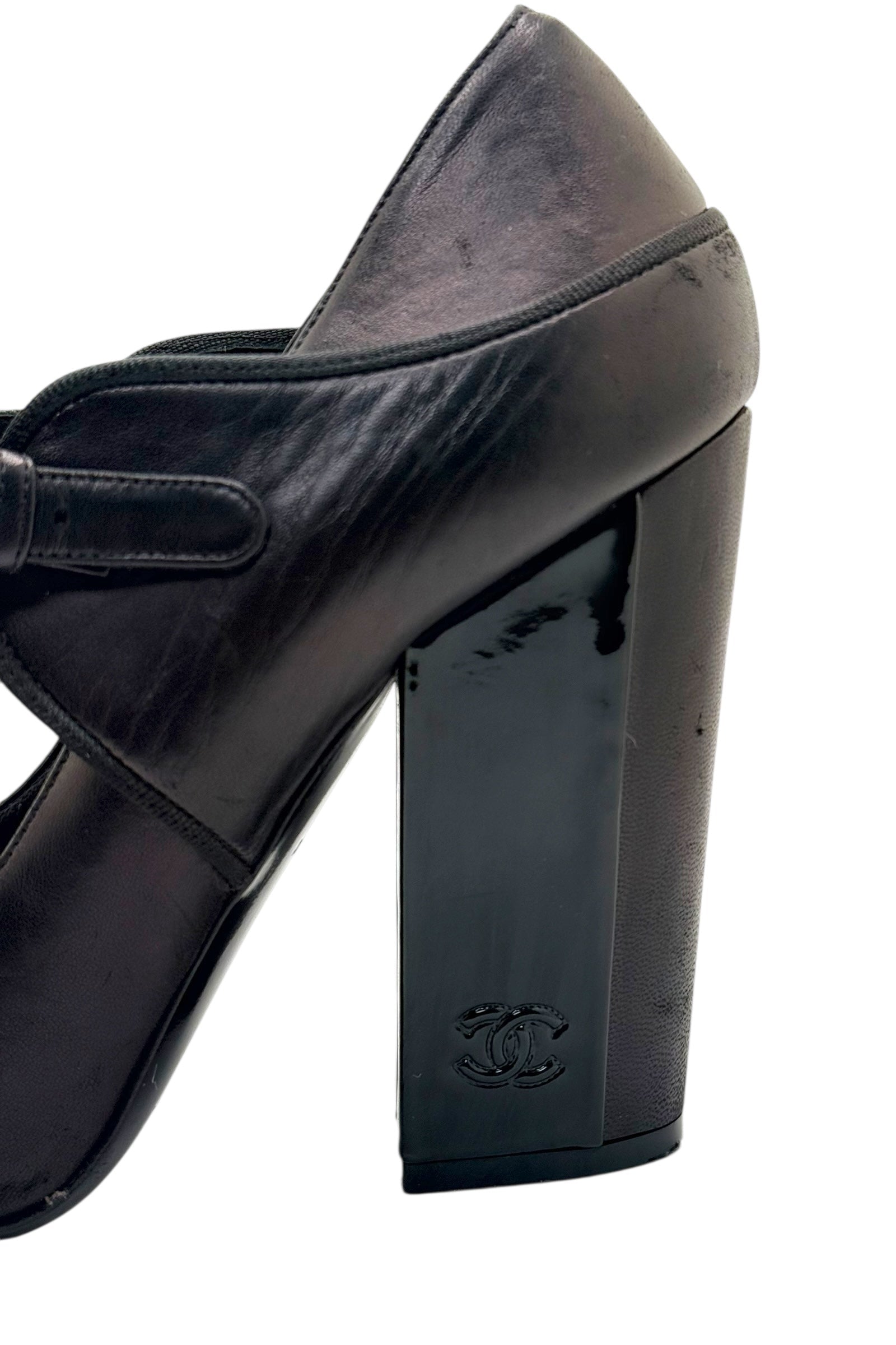 Side profile of Chanel block heel Mary Jane pump showing heel structure and smooth leather finish.