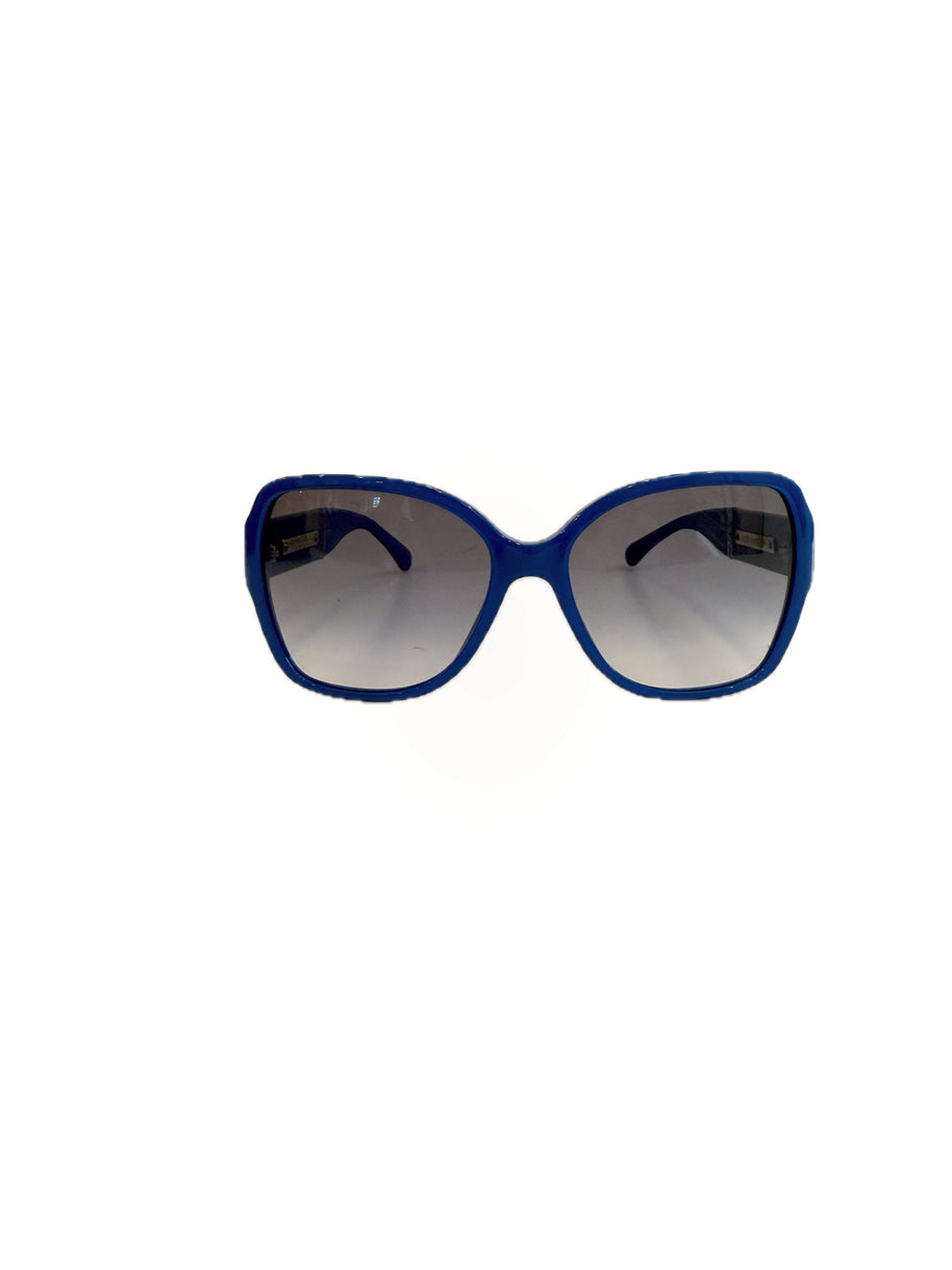 Chanel blue oversized frame sunglasses with grey gradient lenses on white background.