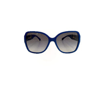 Chanel blue oversized frame sunglasses with grey gradient lenses on white background.