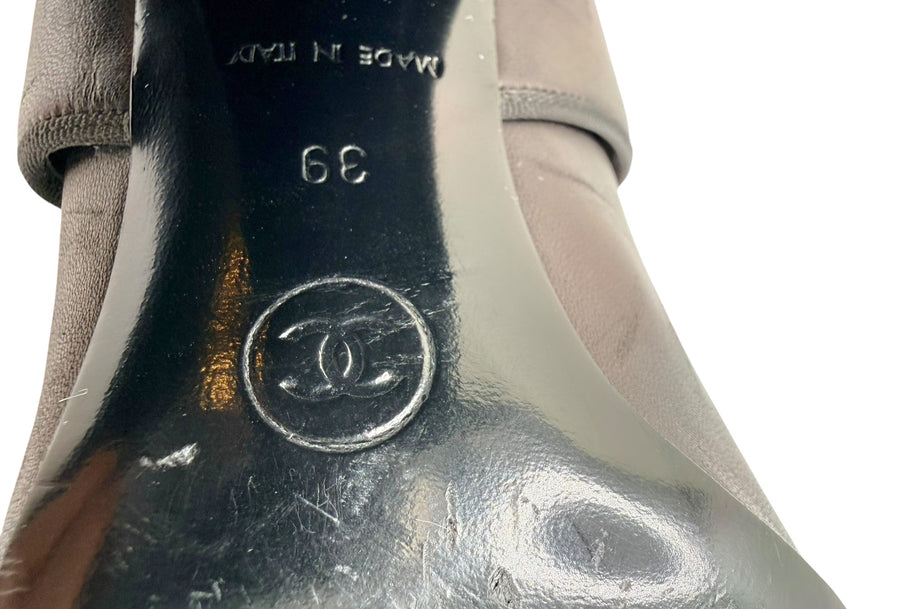 Close-up of Chanel CC logo and size 39 stamped on sole of Mary Jane block heel pump.