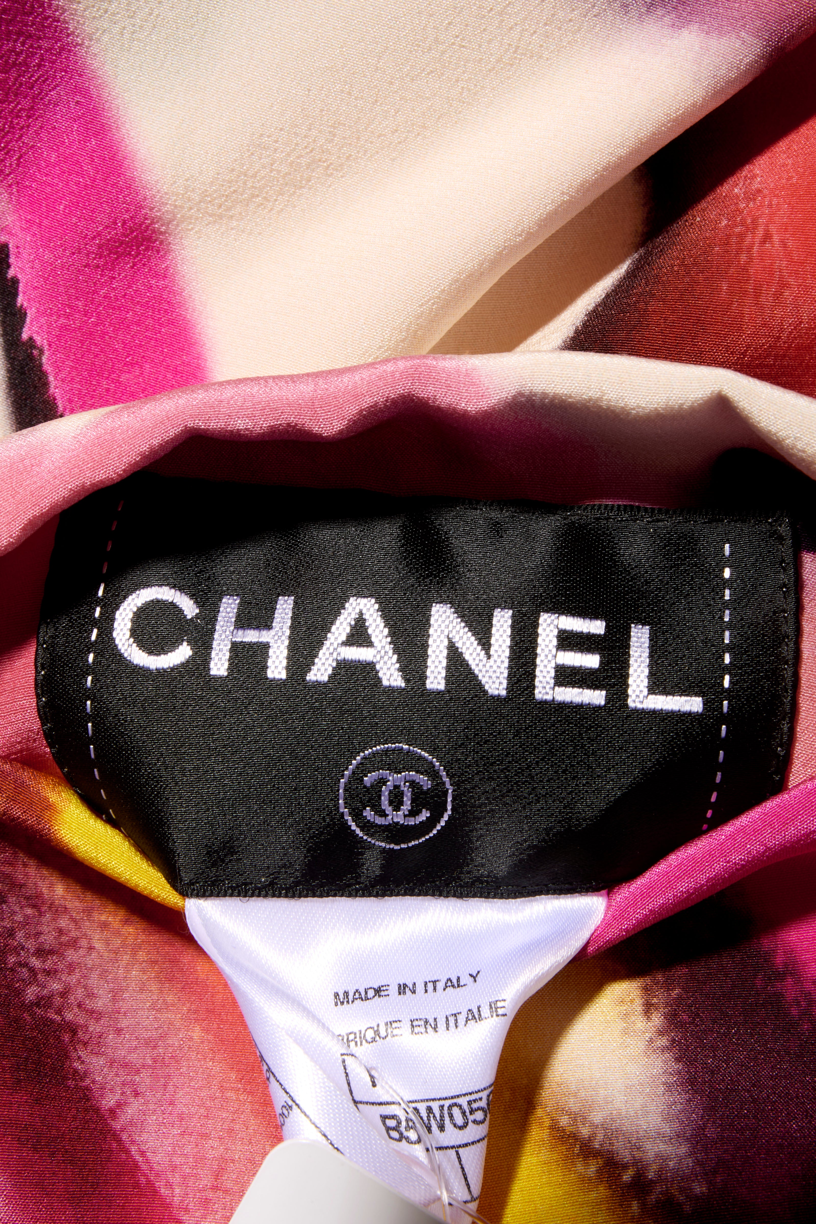 Close-up of a Chanel label on attached to the colorful floral print fabric 