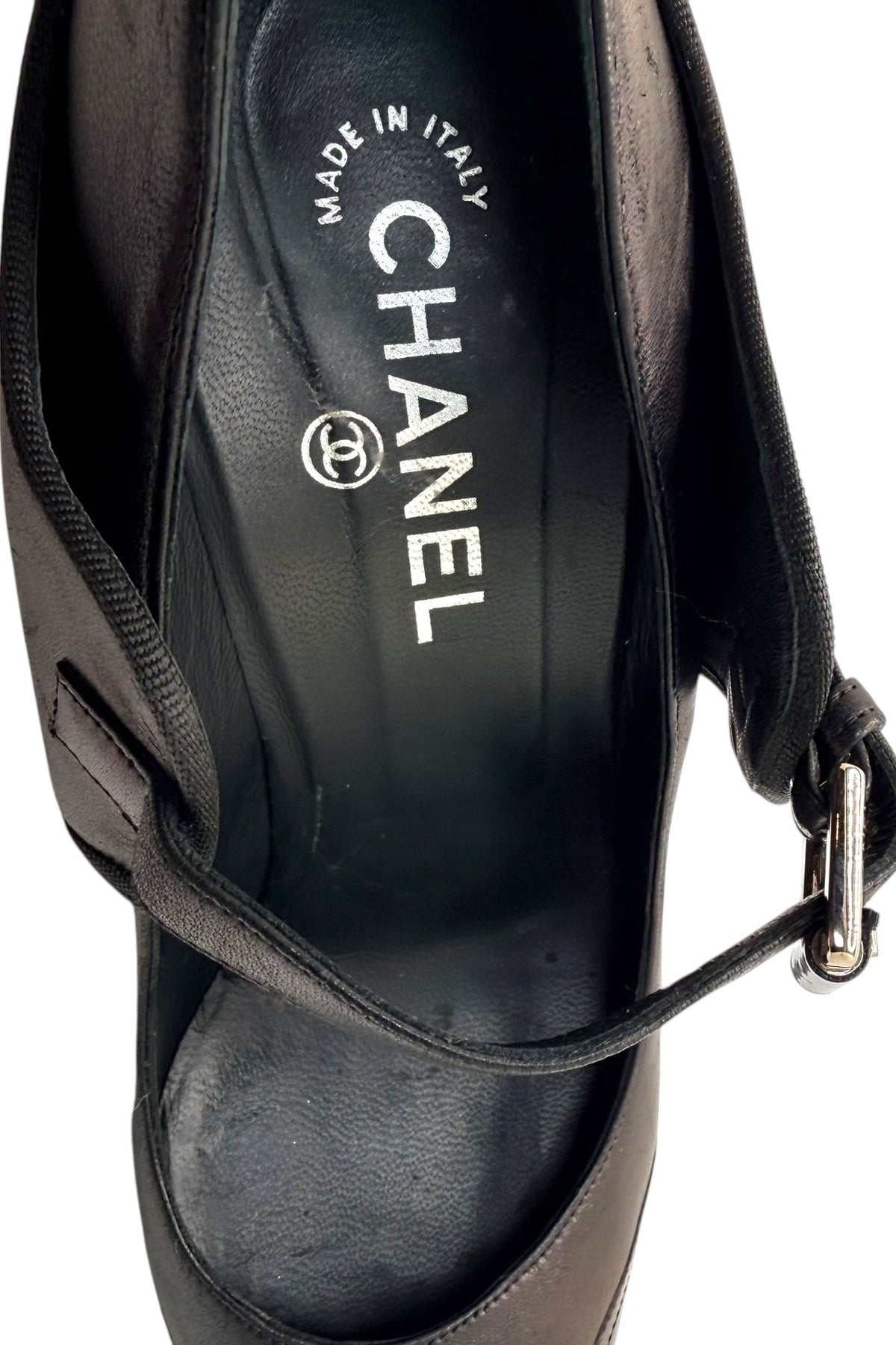 Interior view of Chanel Mary Jane pumps showing leather lining and Chanel logo insole.