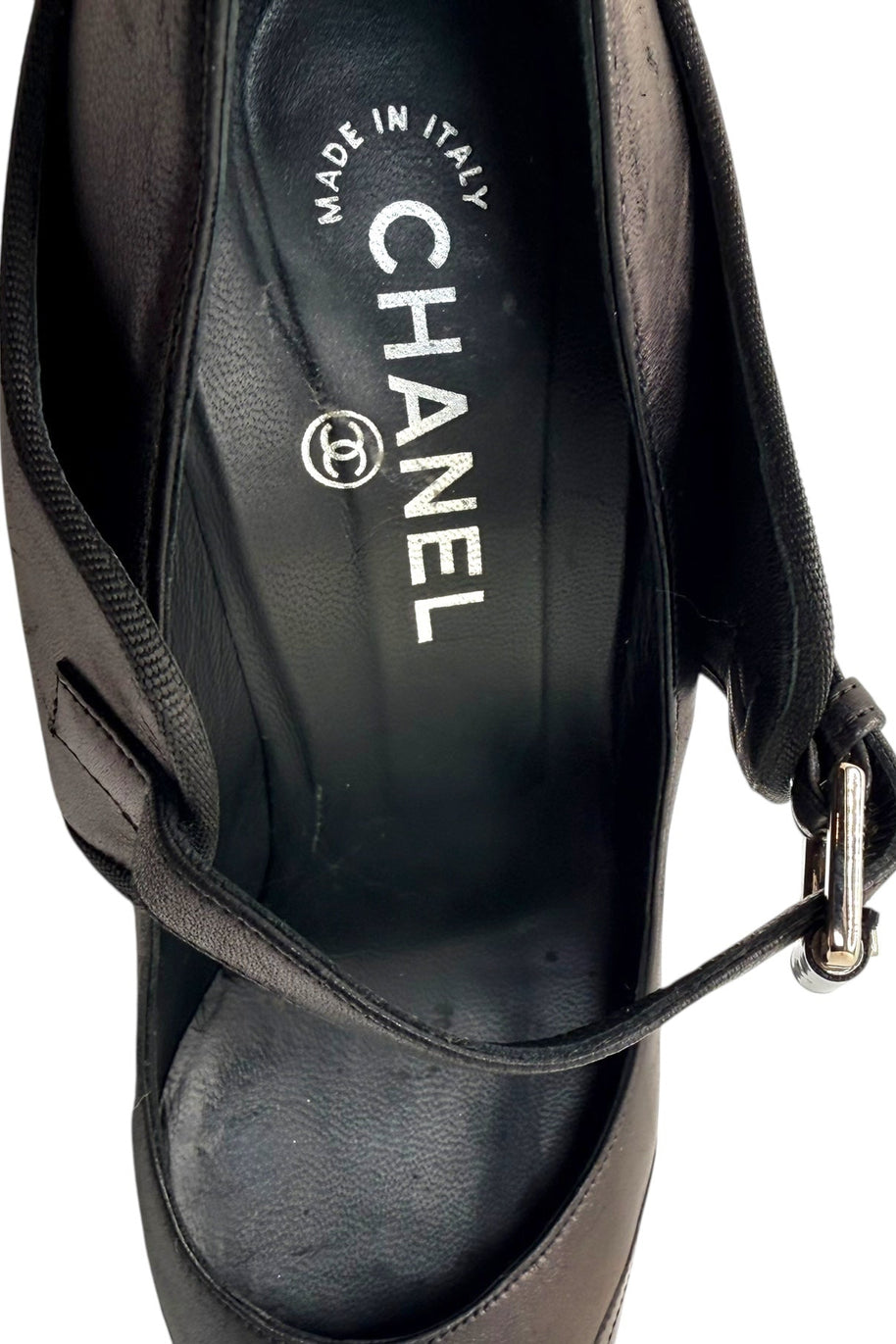 Interior view of Chanel Mary Jane pumps showing leather lining and Chanel logo insole.