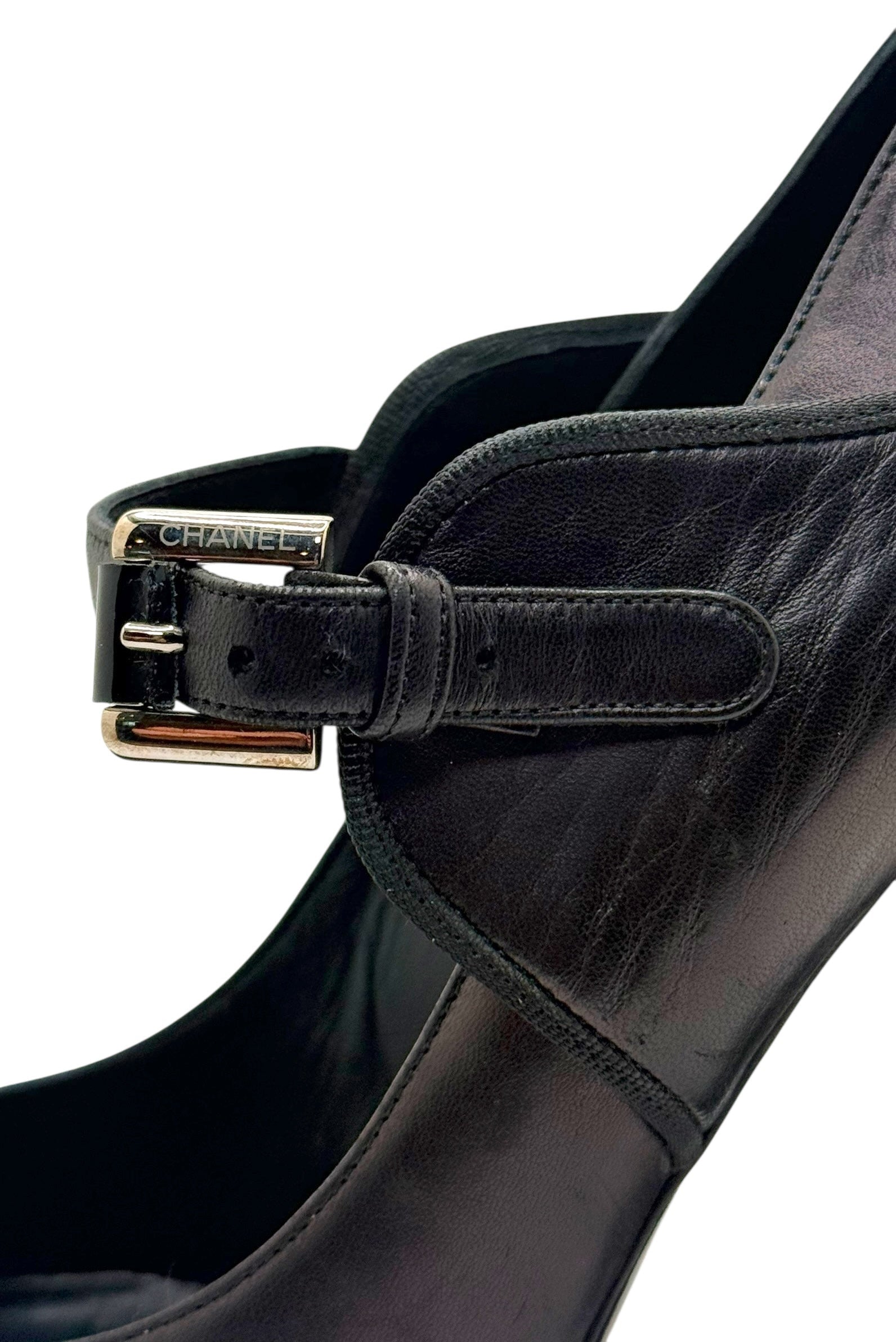 Side detail of Chanel Mary Jane strap and leather upper on block heel pump.