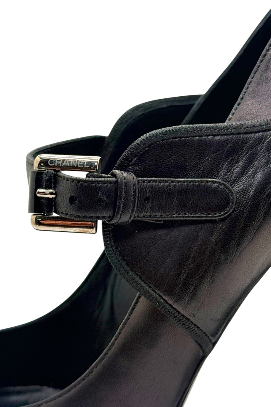 Side detail of Chanel Mary Jane strap and leather upper on block heel pump.