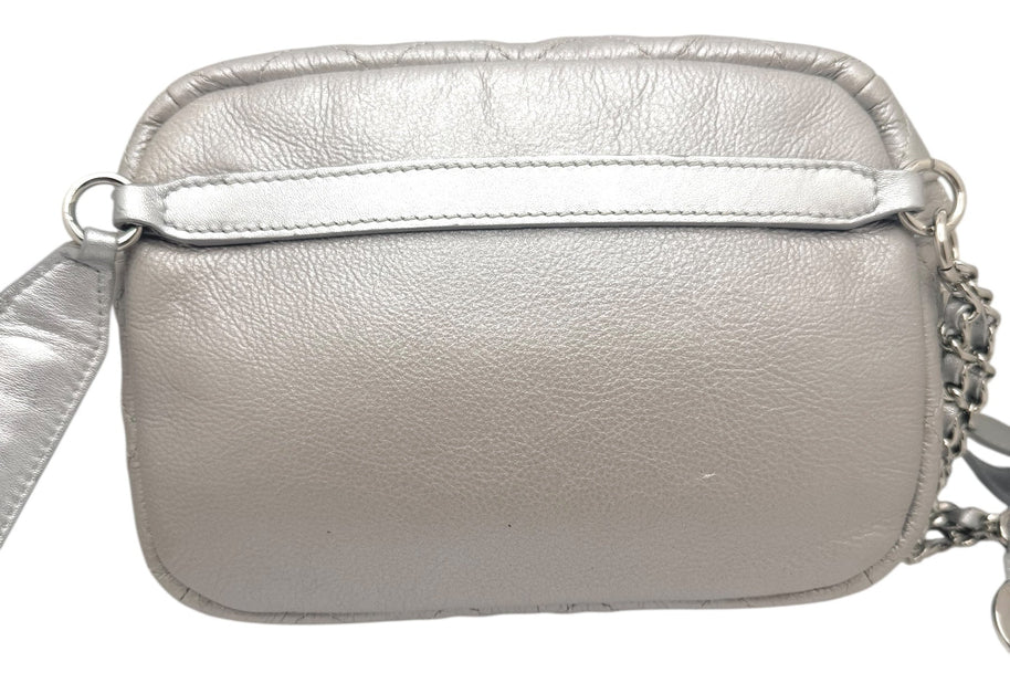 Rear strap detail of Chanel SS17 metallic silver bum bag featuring adjustable leather belt strap and polished silver tone hardware.