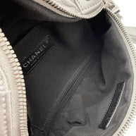 Interior pocket view of Chanel SS17 metallic silver bum bag featuring black textile lining and stitched interior compartment.